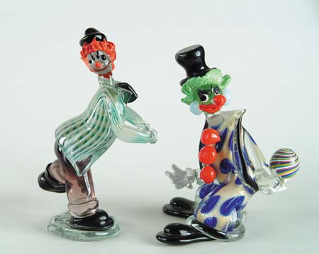 Appraisal: TWO ITALIAN COLORED GLASS CLOWNS Clown holds swirled ball in