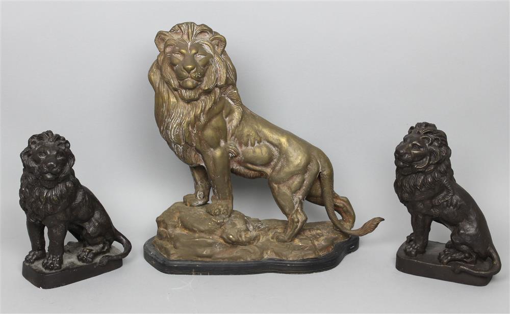 Appraisal: THREE PATINATED METAL FIGURES OF LIONS including a pair seated