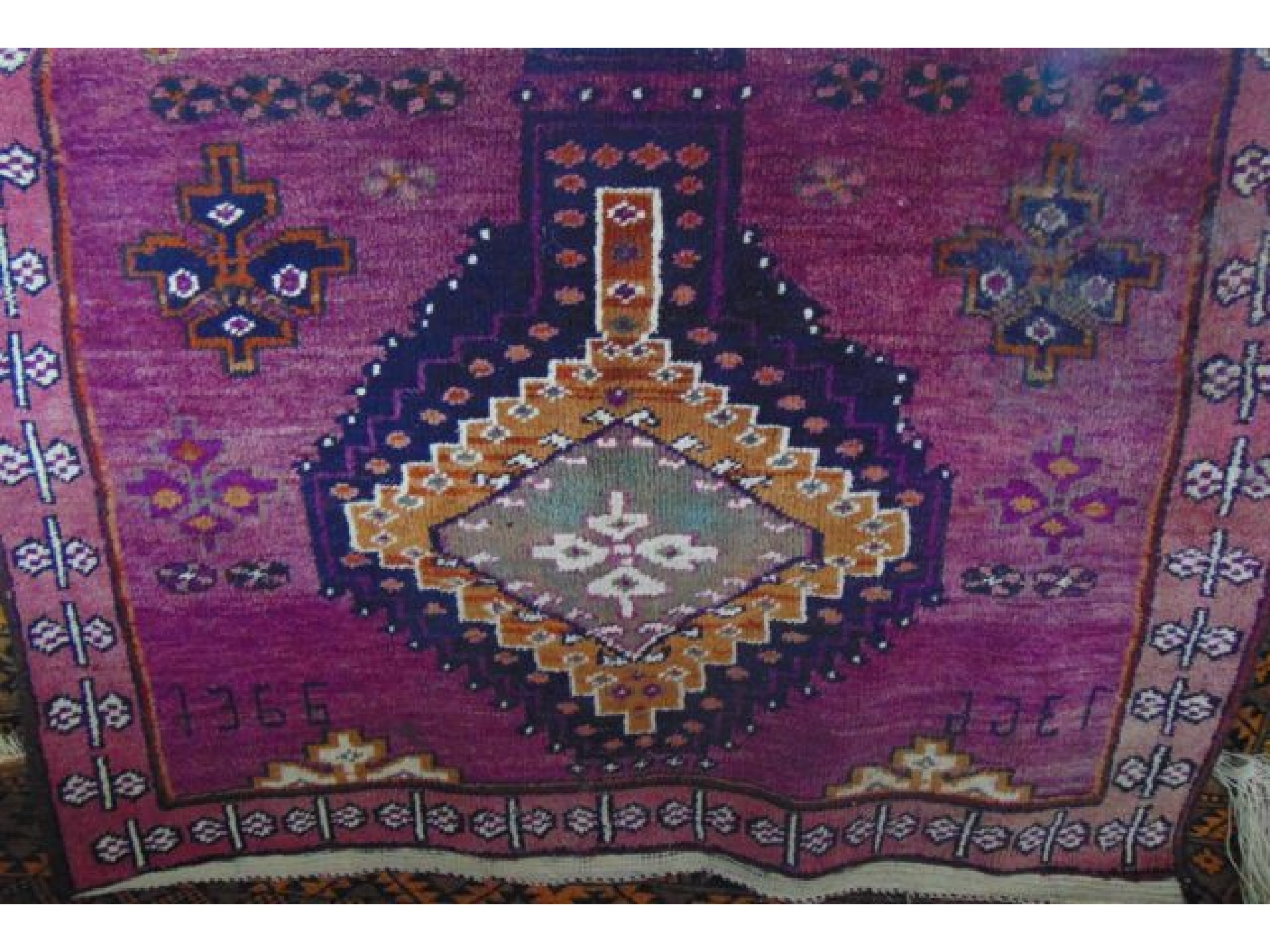 Appraisal: A coarse woven wool rug in the Persian manner with