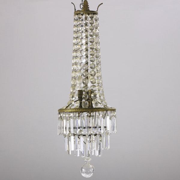 Appraisal: Crystal and bronze chandelier early th C Multi-tiered with prisms