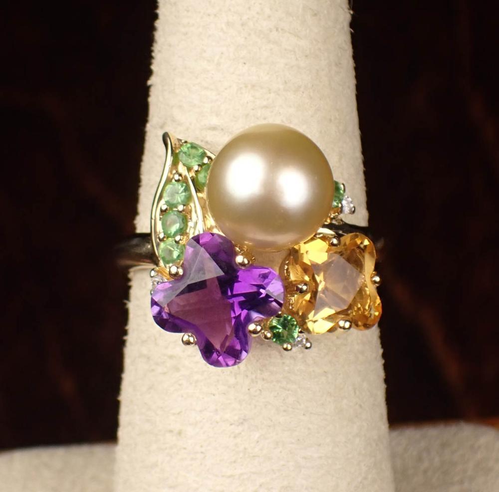 Appraisal: MULTI GEMSTONE AND FOURTEEN KARAT GOLD RING The yellow gold