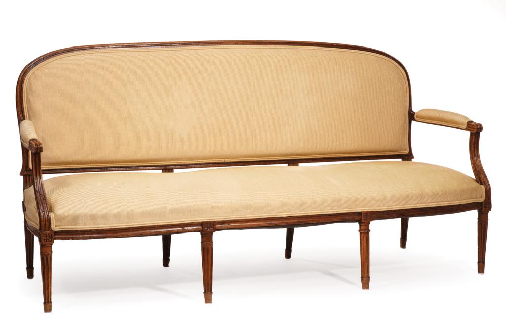 Appraisal: Louis XVI-Style Fruitwood Settee arched back padded arms fluted legs