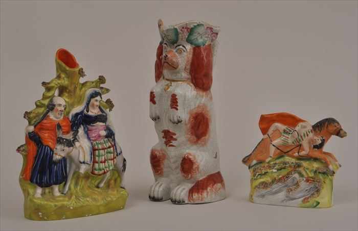 Appraisal: THREE STAFFORDSHIRE ARTICLES Comprising a spaniel-form pitcher a spill vase