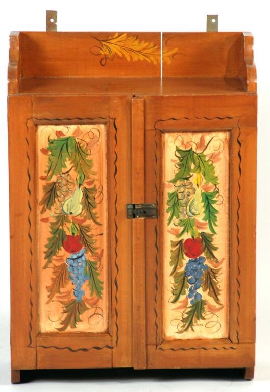 Appraisal: Flower and leaf decorated mixed wood hanging cupboard signed C