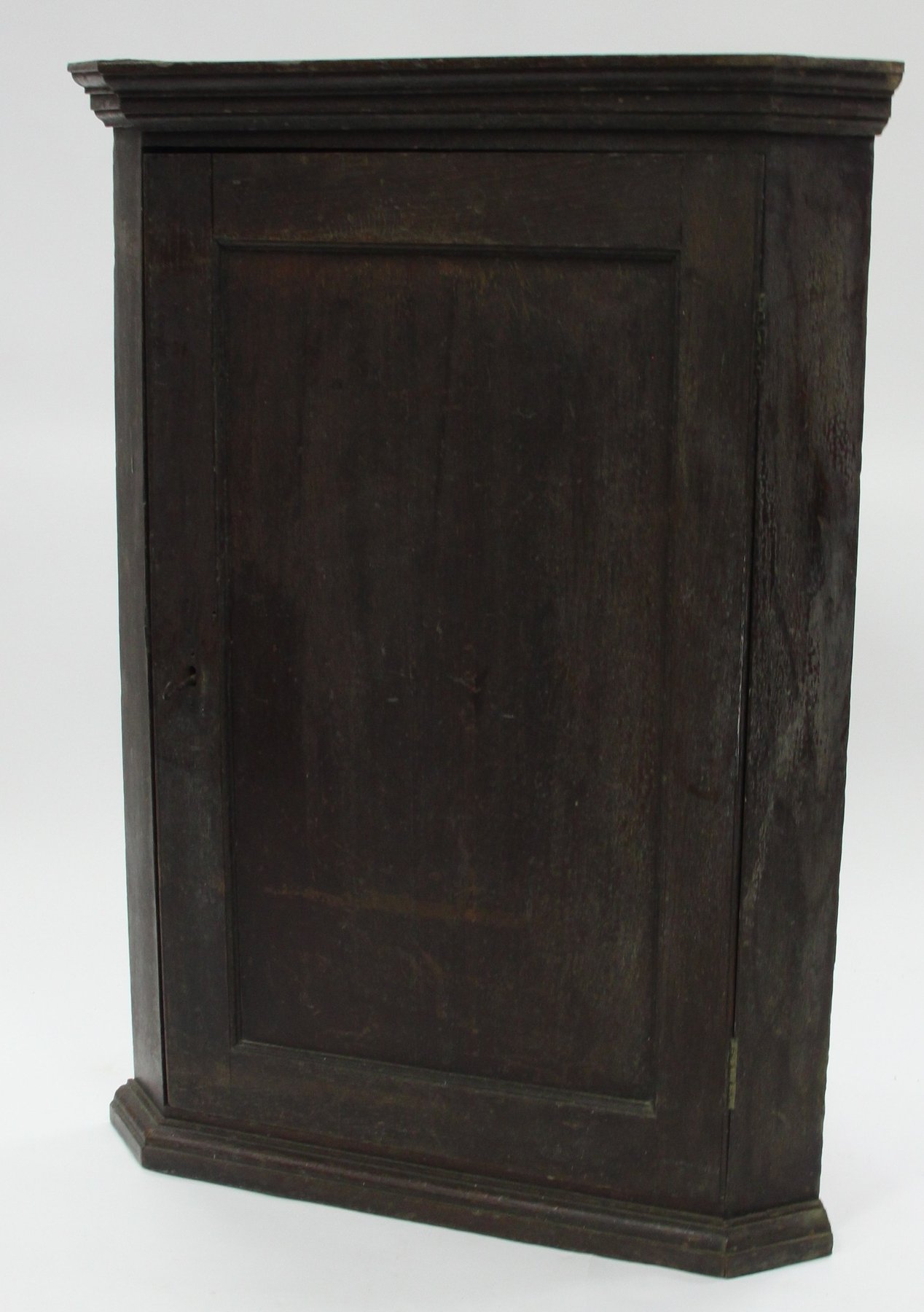 Appraisal: A George III oak corner cupboard