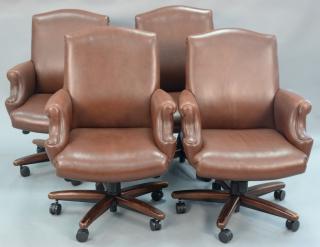 Appraisal: Set of four Cabot Wrenn leather armchairs having swivel bases