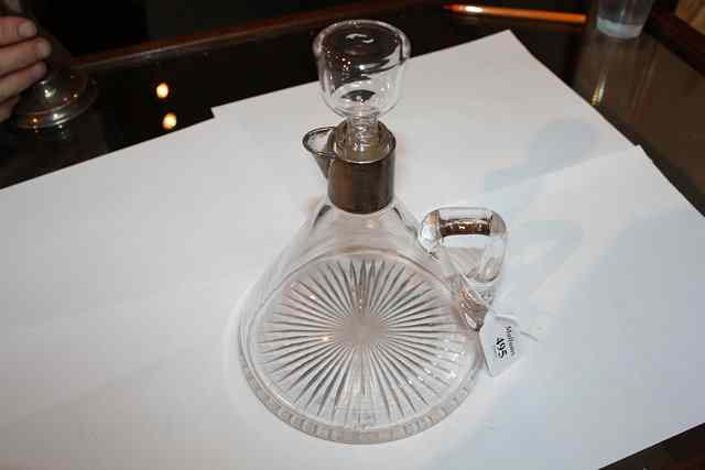 Appraisal: A SILVER MOUNTED DECANTER AND STOPPER of triangular shape with