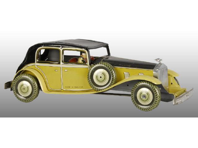 Appraisal: English Tin Wind-Up Toy Automobile Description Working Includes original driver