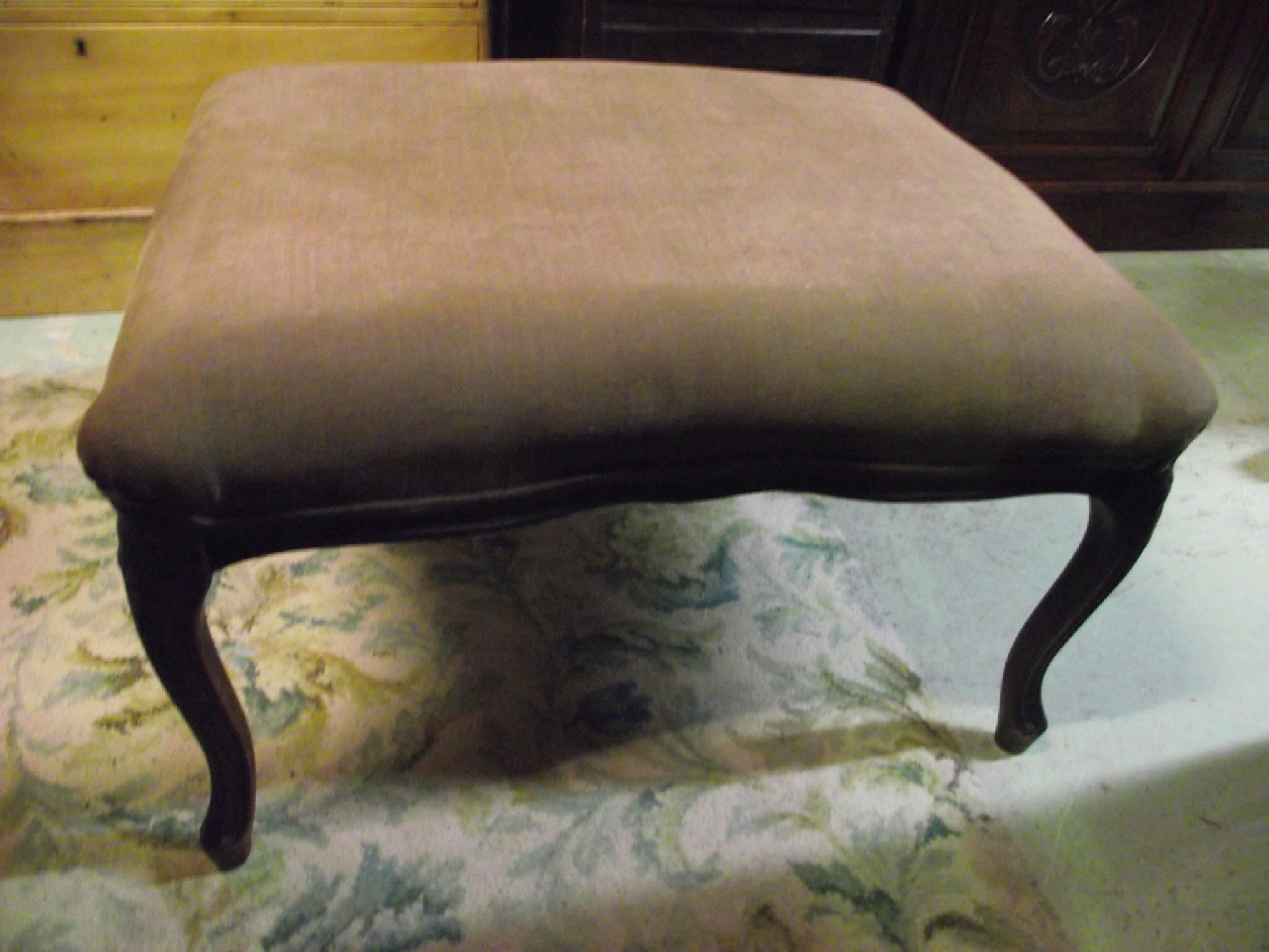 Appraisal: A stool the upholstered seat with serpentine outline and carved