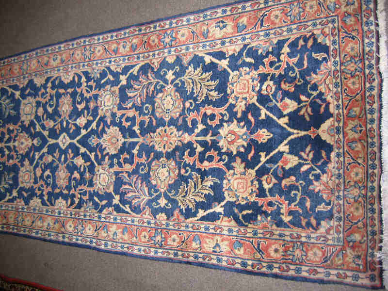 Appraisal: SAROUK RUNNER The indigo field of allover curvilinear floral motifs