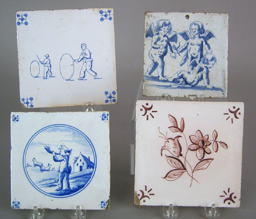 Appraisal: Four Delft tiles th c depicting cherubs men with hoops