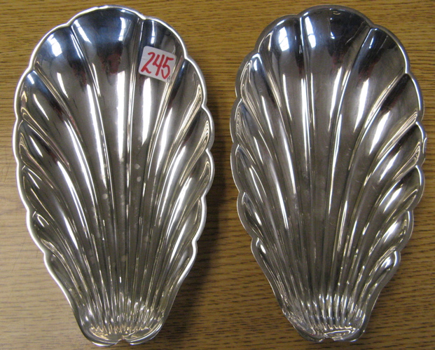 Appraisal: PAIR REED BARTON STERLING SILVER BOWLS shell form supported on