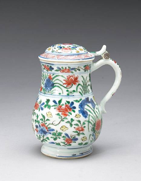 Appraisal: A wucai-decorated export porcelain tankard and cover Kangxi The hinged