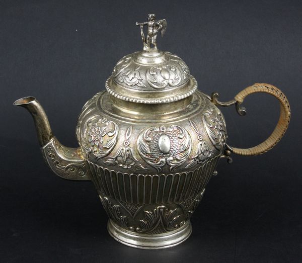 Appraisal: Dutch silver teapot with winged cherub finial wicker handle h