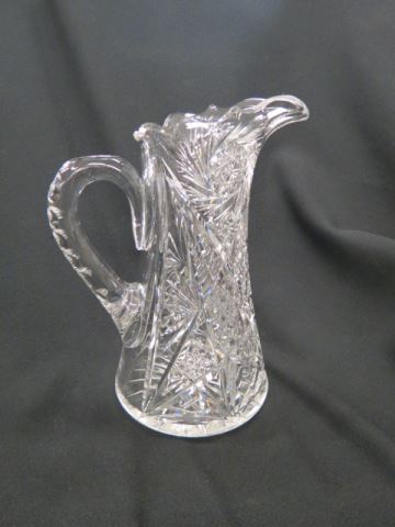 Appraisal: Cut Glass Pitcher brilliant period pinwheels cane fancy cross-hatching excellent