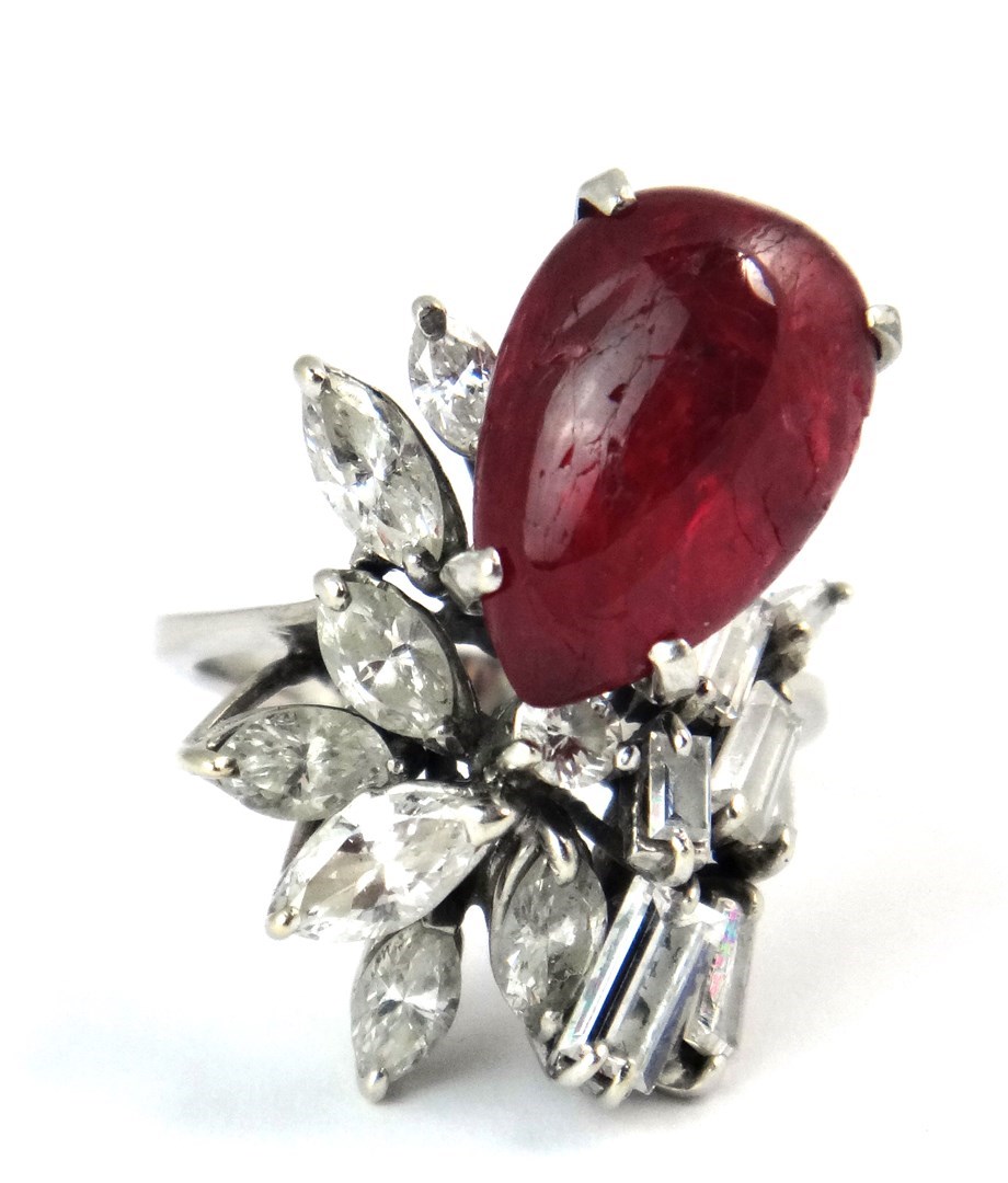 Appraisal: A diamond and cabochon ruby set ring in an abstract