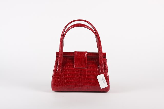 Appraisal: Nancy Gonzalez red legal crocodile handbag suede lining cloth cover