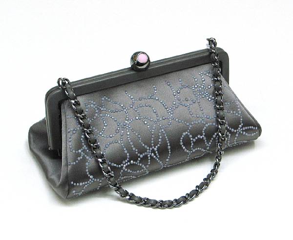 Appraisal: A Chanel grey satin evening bag applied with pale pink