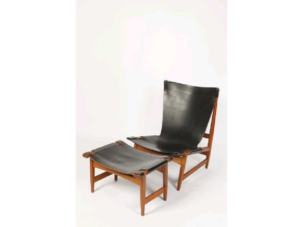 Appraisal: A DANISH TEAK AND LEATHER LOUNGE CHAIR AND FOOTSTOOL the