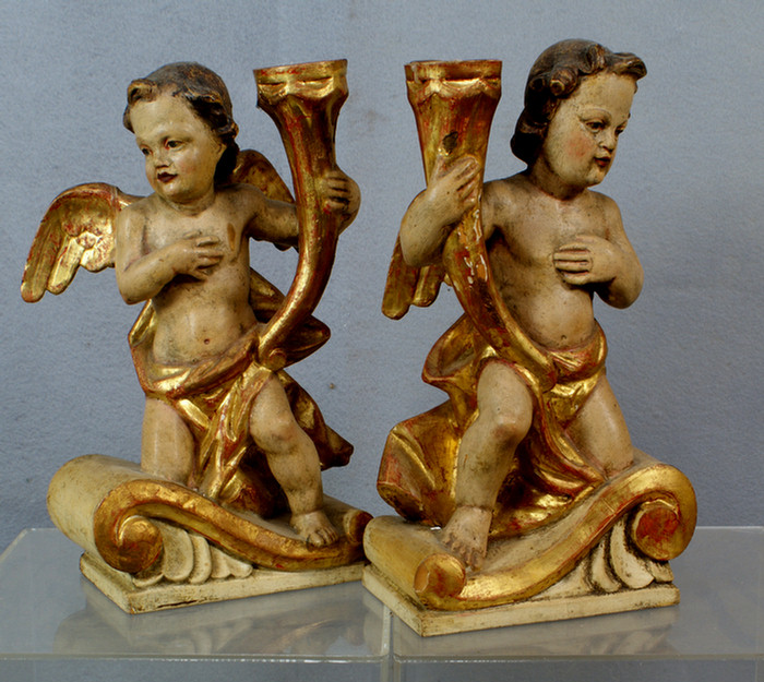 Appraisal: Pair of Italian carved and painted in gilt wood candlesticks