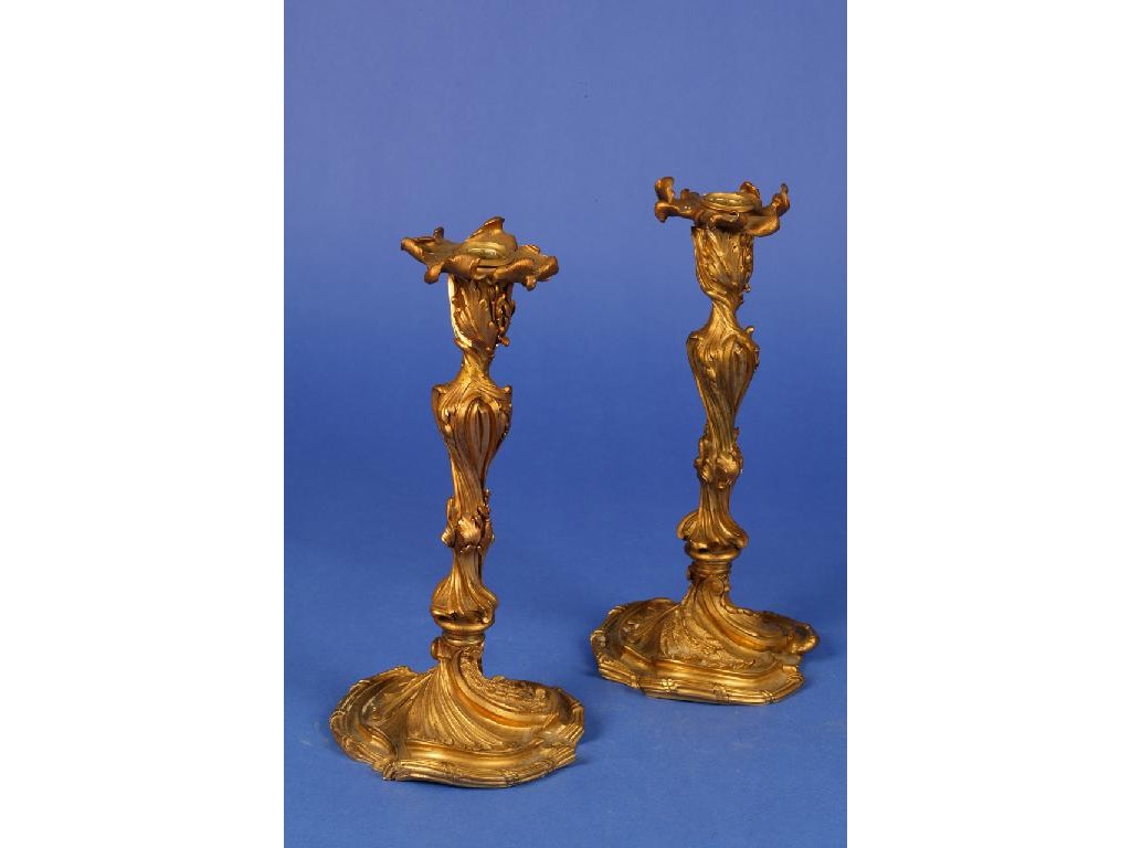 Appraisal: A LOUIS XV STYLE ORMOLU CANDLESTICK of rococo design the