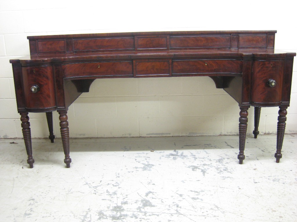 Appraisal: A th Century mahogany Sideboard the raised back fitted slides