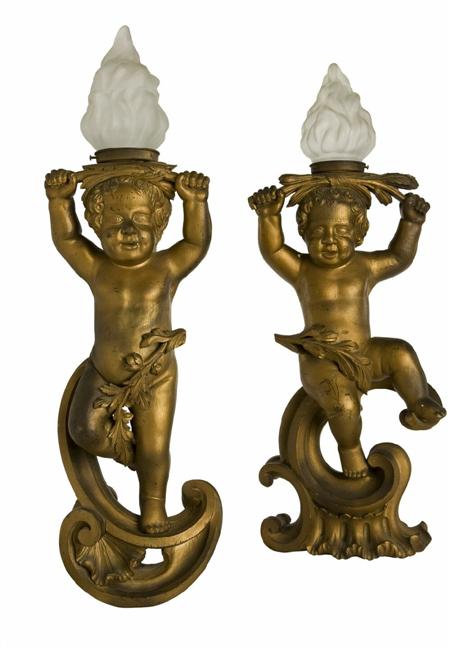 Appraisal: A pair th century Baroque style giltwood newel post lamps