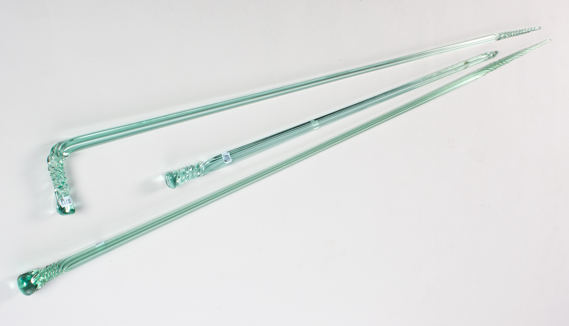 Appraisal: Three glass parade canes first half- th century all three