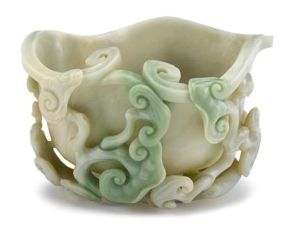 Appraisal: Large Chinese jadeite lingzhi form bowl The fluted rim of