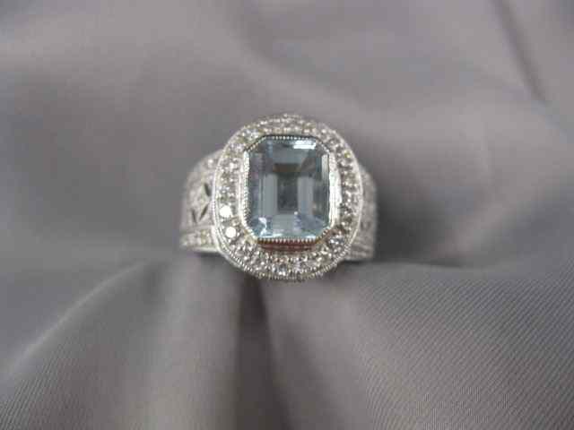 Appraisal: Aquamarine Diamond Ring emerald cut carat gem surrounded by diamonds