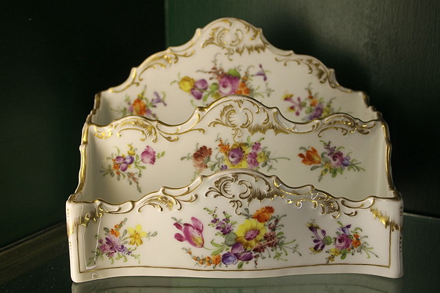 Appraisal: A DRESDEN WHITE GROUND PORCELAIN LETTER RACK painted with sprays