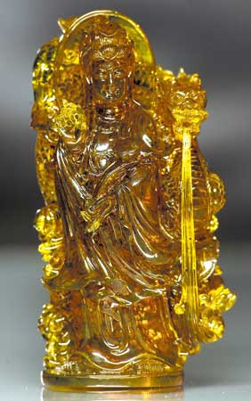 Appraisal: CARVED AMBER GUANYIN Superbly carved and meticulously detailed Chinese transparent