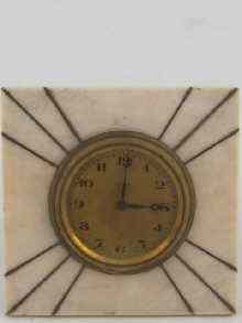 Appraisal: An ivory eight day strut clock inlaid with yellow metal