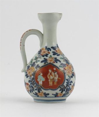 Appraisal: A Japanese Imari cruet bottle decorated with two panels of