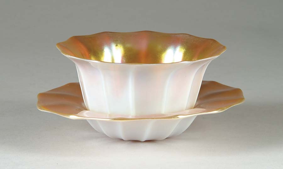 Appraisal: STEUBEN BOWL AND UNDER PLATE Exceptional gold aurene interiors with