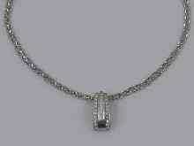 Appraisal: A white metal tests ct gold diamond set pendant Pendant