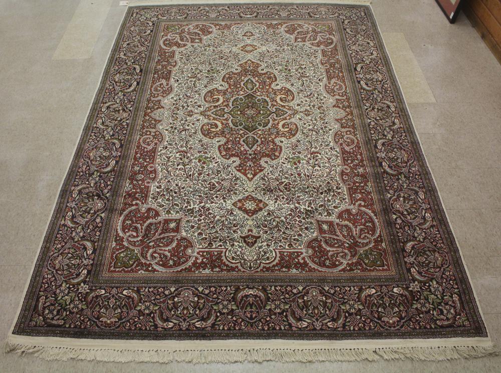 Appraisal: HAND KNOTTED ORIENTAL CARPET Indo-Persian floral and central floral medallion