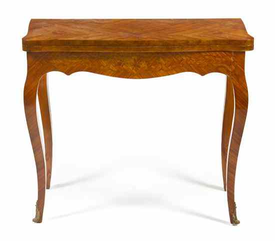 Appraisal: A Continental Marquetry Games Table having a shaped rectangular top