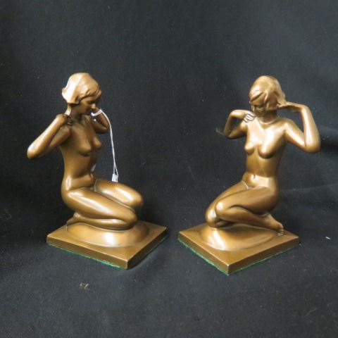 Appraisal: Pair of Art Deco Bookends of Nudes kneeling bronzed Frankart