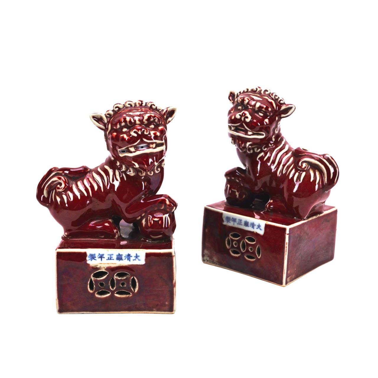 Appraisal: PAIR OF CHINESE SANG DE BOEUF FU LIONS Pair of