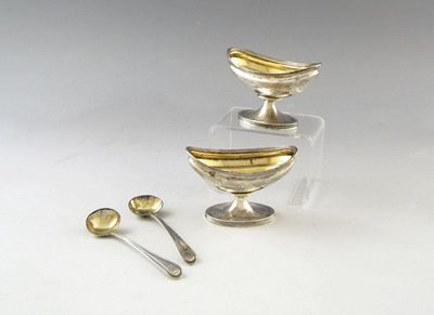 Appraisal: A pair of George III navette-shaped salts with an engraved