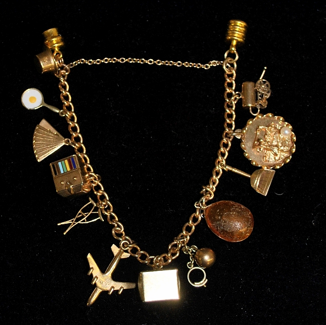 Appraisal: - Unmarked tested k gold charm bracelet with a gold-filled