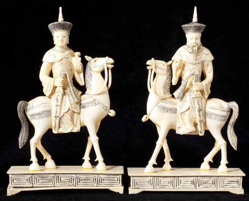 Appraisal: Pair of Antique Asian Ivory Figures on Horsebacka man and