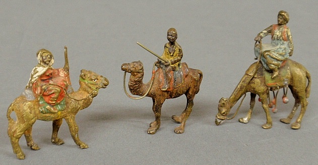 Appraisal: - Three small Austrian cold painted bronze figures of Arabs