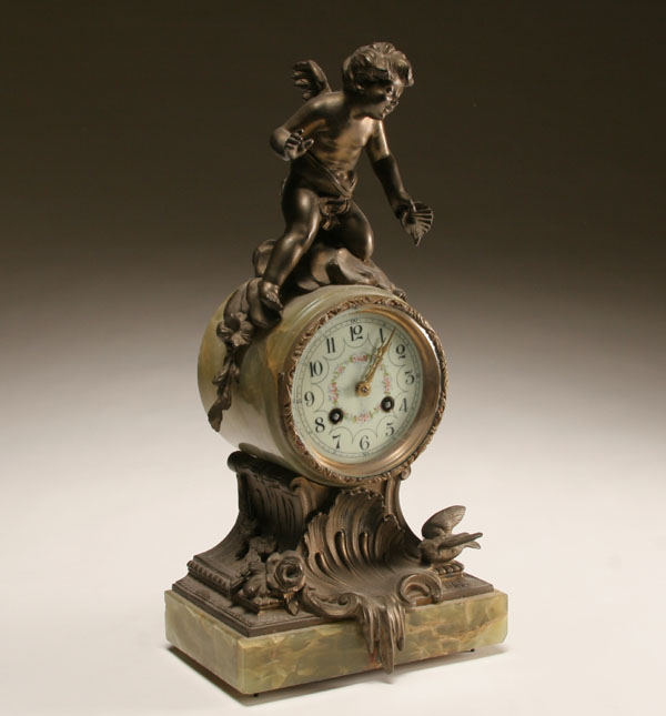 Appraisal: Key wind marble clock with cherub mount white metal stand