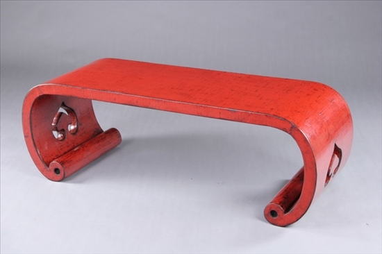 Appraisal: CHINESE RED LACQUERED WOOD LOW TABLE th century Scroll-form -