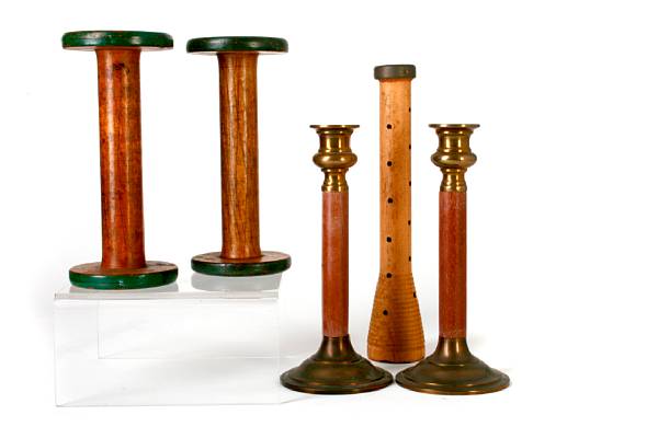 Appraisal: A collection of wooden spools and candlesticks height of tallest