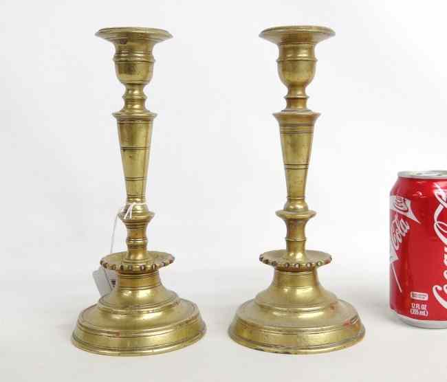 Appraisal: Near pair th c brass brass candlesticks with scalloped mid