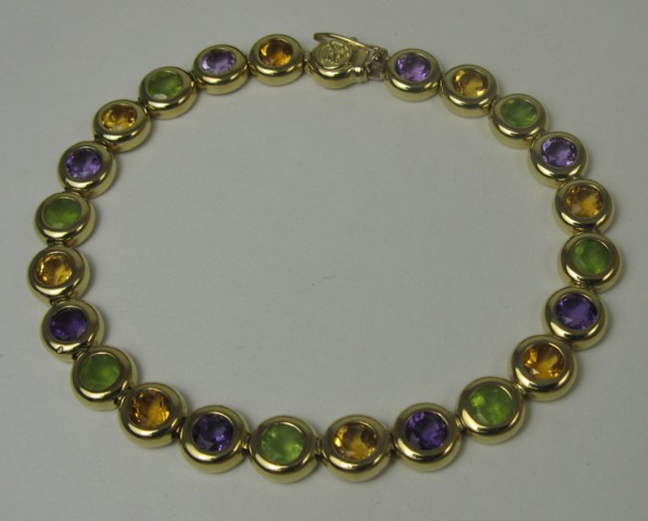 Appraisal: AMETHYST CITRINE AND PERIDOT BRACELET The k yellow gold bracelet