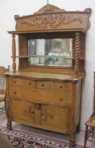 Appraisal: LATE VICTORIAN OAK SIDEBOARD American c having a mirror-paneled top